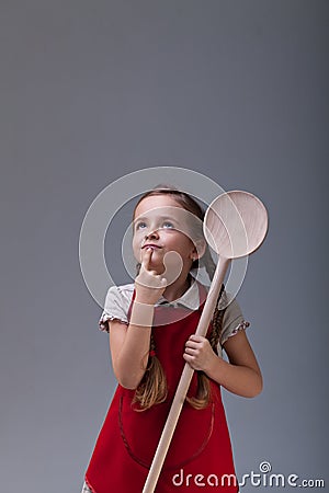 Little chef thinking about what to cook Stock Photo