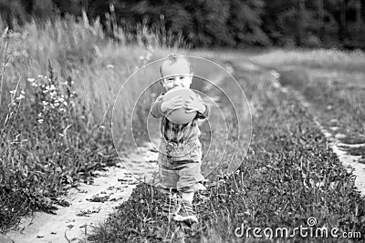 Little child with ball outdoors Stock Photo