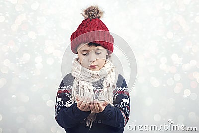 Little child blows snow Stock Photo