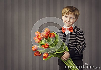 Little Child Boy Giving Flowers Bouquet, Handsome Kid Greeting R Stock Photo