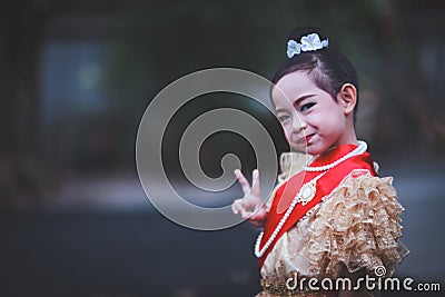 A little child girl wearing a Thai dress that expresses the unique and beautiful Thai culture Stock Photo