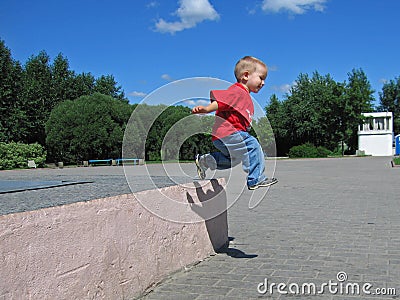 Little child jump long Stock Photo
