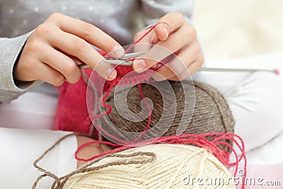 Little child learns to knit. Stock Photo