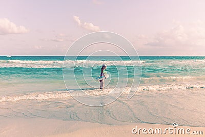 Little child by the ocean. wants to learn to swim Stock Photo