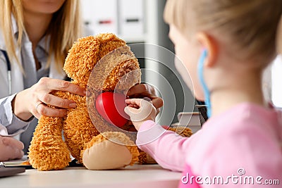 Little child at pediatrician reception listen Stock Photo