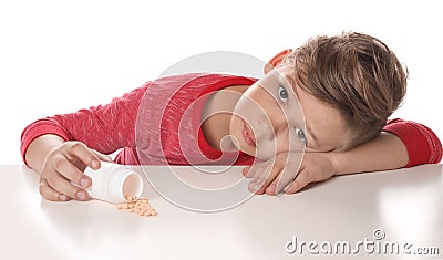 Little child with pills. Danger of medicament intoxication Stock Photo