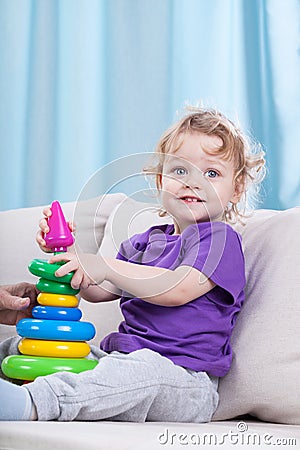 Little child playing with toys Stock Photo