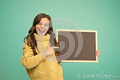 Little child point fingers at something. welcome on board. best prices. useful info here. happy small girl hold Stock Photo