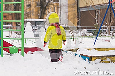 Little child walk on winter playground Stock Photo