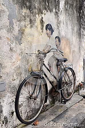 Little Children on a Bicycle street art mural by Lithuanian artist Ernest Zacharevic in Georgetown, Penang, Malaysia. Editorial Stock Photo