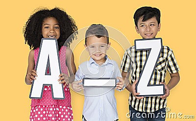 Little Children Holding A-Z Papercraft Stock Photo