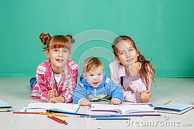 Little children learn to write and read. The concept of childhood, learning, friendship, family, school lifestyle Stock Photo