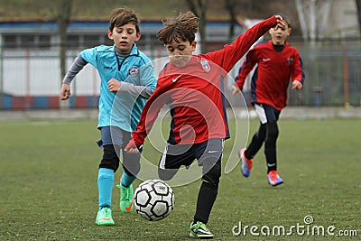 Little children playing football or soccer Editorial Stock Photo