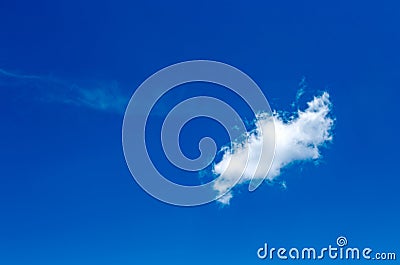 Little cloud crosses the blue sky Stock Photo