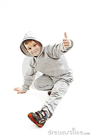 Little cool hip-hop boy in dance showing ok sign Stock Photo