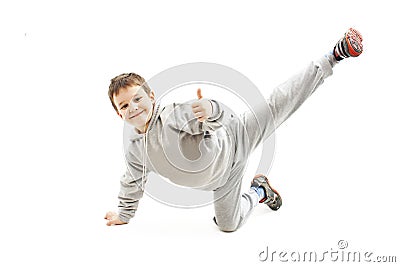 Little cool hip-hop boy in dance showing ok sign Stock Photo