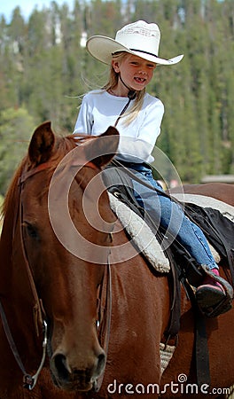 Little Cowgirl on Horseback #2 Stock Photo