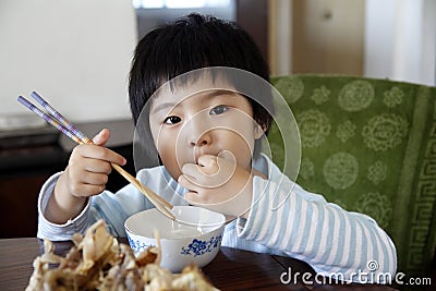 Little cute asian girl eating Stock Photo