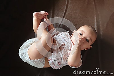 The little cute baby infant boy sucking thumb hand Stock Photo