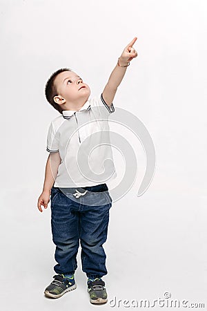 Little boy pointing by finger up and looking at stars. Stock Photo