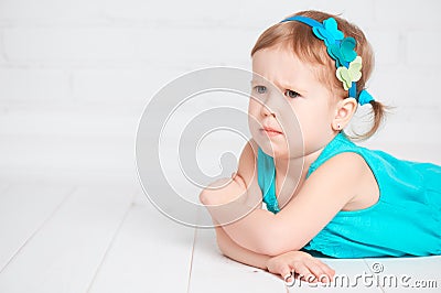 Little cute girl offended, angry frown Stock Photo