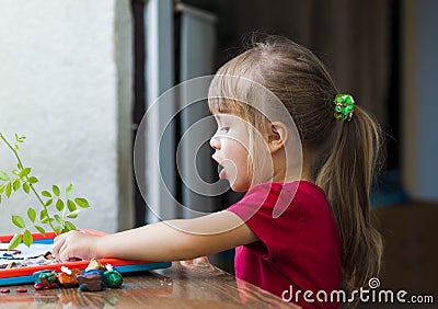 Little cute girl playing table play outside Stock Photo