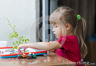 Little cute girl playing table play outside Stock Photo