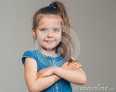 Little cute girl portrait cross hands Stock Photo