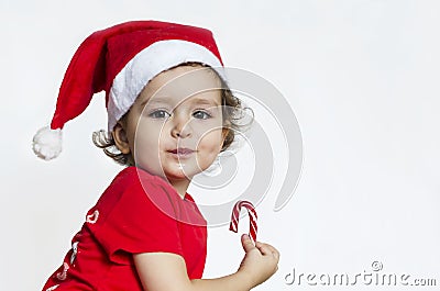 Baby eats New Year`s sweets with an appetite. Stock Photo