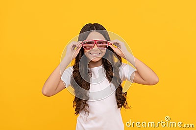 little cutie. funky teen girl having fun. cheerful child in glasses. fashion accessory. going crazy. Stock Photo