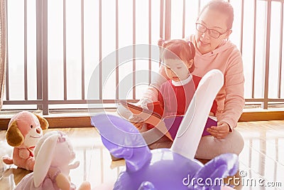 Little daughter homeschool alone with dolls Stock Photo