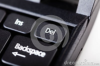 Little delete del laptop key macro, extreme closeup selective focus. Small laptop notebook key up close. Deleting files Stock Photo
