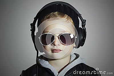 Little DJ. funny boy in sunglasses and headphones.child listening music in headphones. deejay Stock Photo