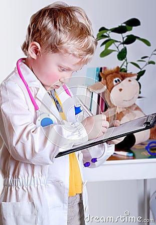 Little doctor with clip board Stock Photo