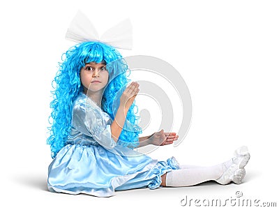 Little doll girl with blue hair Stock Photo