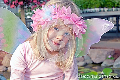 Little fairy girl in garden Stock Photo