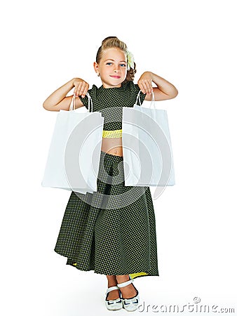 Little fashionista holding shopping bags Stock Photo