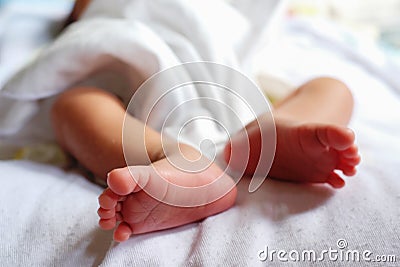 little feet a newborn baby on white. soft focus Stock Photo