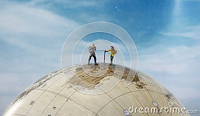 Little fugures walking australia on the globe Stock Photo