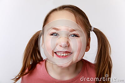 Little funny emotional girl with an open smile Stock Photo