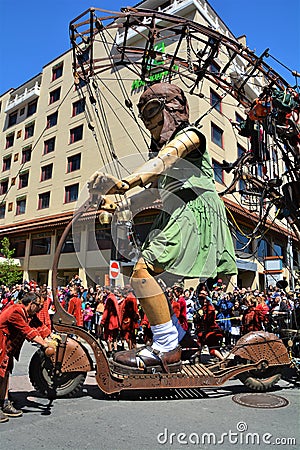 The little giant girl riding a kicksled Editorial Stock Photo