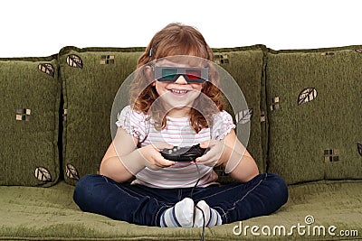 Little girl with 3d glasses play video game Stock Photo