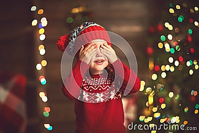 Little girl in anticipation of a Christmas miracle and a gift Stock Photo