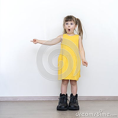 Little girl in big daddy boots Stock Photo