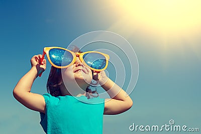 Little girl with big sunglasses Stock Photo