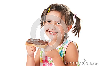 Little girl biting a snack Stock Photo