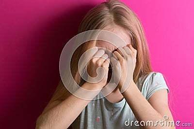 Little girl blonde on a pink background Stock Photo