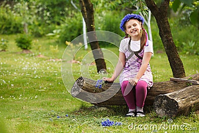 Little girl with blue chaplet Stock Photo