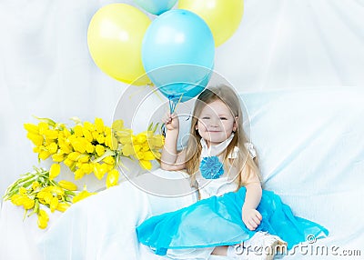 Little girl with bouquet of tulips Stock Photo