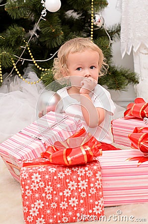 Little girl with boxes of presents Stock Photo